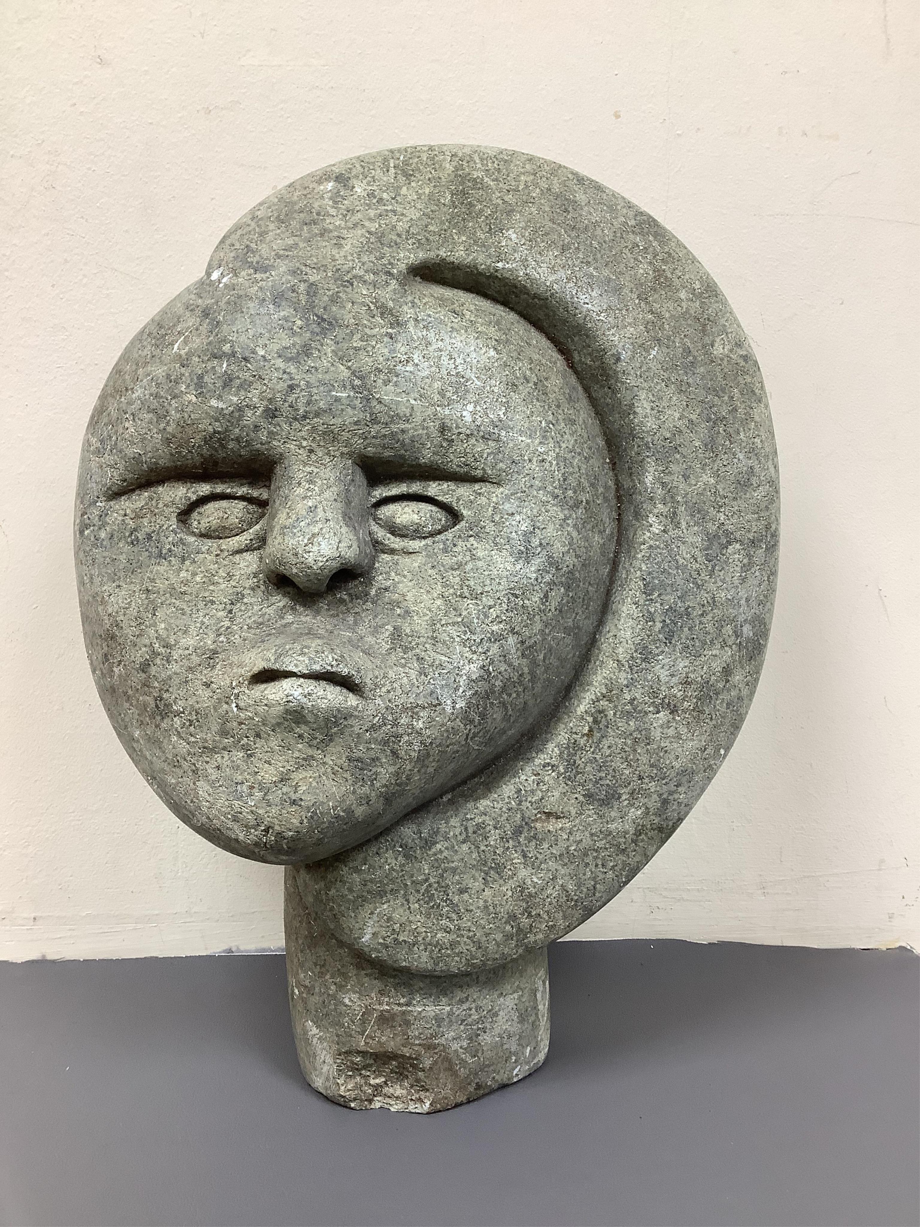 Style of Josia Manzi - a carved serpentine stone head, 37cm